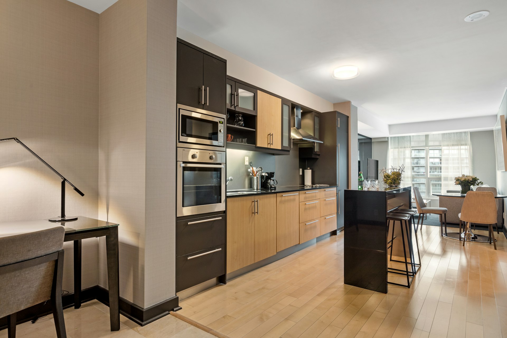 black and silver microwave oven on brown wooden kitchen cabinet